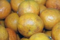 Backdrop of many orange. it is a round juicy citrus fruit.