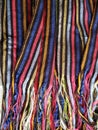 approach to a multicolored mexican rebozo with stripes, background and texture