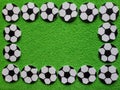 frame with soccer ball figures and green background