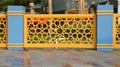 Backdrop of yellow guardrail with ornamental Turkish ottoman star Islamic pattern