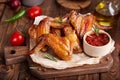 Backed Chicken wings served with rosemary and barbecue sauce. Royalty Free Stock Photo