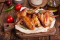 Backed Chicken wings served with rosemary. Royalty Free Stock Photo