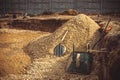 Backfilling of the excavation under the foundation slab. Construction, dolomite, shovels and wheelbarrow. Royalty Free Stock Photo