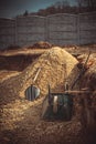 Backfilling of the excavation under the foundation slab. Construction, dolomite, shovels and wheelbarrow. Royalty Free Stock Photo