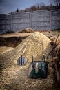 Backfilling of the excavation under the foundation slab. Construction, dolomite, shovels and wheelbarrow. Royalty Free Stock Photo