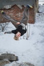 Backflip parkour in winter snow park - blonde hair teenager