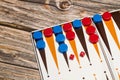A backgammon board with red and blue checkers and small dices Royalty Free Stock Photo