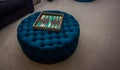 Backgammon Game On Blue Upholstered Ottoman