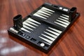 Backgammon set : Board game on wooden floor. Royalty Free Stock Photo