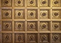 Geometrical squares with central decoration golden plaster ceiling from historical Palace in Caserta, Italy
