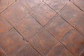 geometrical square semi smooth pale terracotta tiles background floor close up