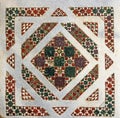 antique close up of vibrant and colorful geometrically patterned marble mosaic tile floorbackground