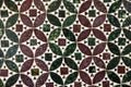 antique close up of pale dark red and green geometrically patterned marble mosaic floor background