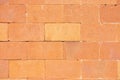 bright and smooth multi tone well maintained orange brick wall close up background