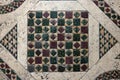 antique close up of earth muted tones geometrically patterned mosaic floor background