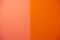 equally vertically divided smooth solid salmon and Spanish orange bright and contemporary stucco wall textured background Royalty Free Stock Photo