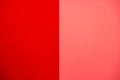 equally vertically divided smooth solid uniform bright and contemporary lifeguard red and hipster salmon stucco wall background