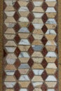 geometrical square earth tone colored geometrical pale marble tiles background floor close up