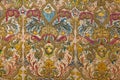 intricate and colorful textile embroidery with elegant floral motives wall background