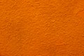 close up of bright grunge Orange Roughy stucco wall texture background Royalty Free Stock Photo