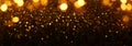 Background of abstract glitter lights. gold and black. de-focused. banner Royalty Free Stock Photo