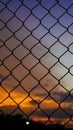 the background of the afternoon sky is orange with the shadow of a safety net. Royalty Free Stock Photo