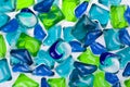Background of all-in-one capsules with laundry detergent and dishwasher soap Royalty Free Stock Photo
