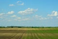 Background from an arable land and the sky with clouds Royalty Free Stock Photo