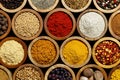 Background of arranged spices in small wood bowls.