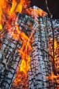 Background asset two ashen logs burning with orange and yellow flames