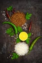 Background with an assortment of different cereals, rice and buckwheat, lime and scented pepper and other spices on the background