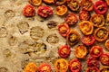 Background of baked or grilled Cherry Tomatoes. Cooked and spiced tomatoes on baking tray.Top view