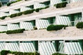 Background of balconies on hotel floors with balcony flowers and partitions.