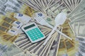 Background From Banknotes Of Various Currencies. Calculator fork and spoon crossed Royalty Free Stock Photo