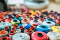 Background banner Side view many multicolored spools of thread that lie in box Royalty Free Stock Photo