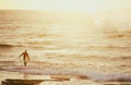 background of the beach, sea and surfer at sunset colors. Royalty Free Stock Photo