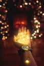 Hand with a Christmas garland in the palm clok Royalty Free Stock Photo