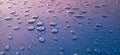 Background of beautiful water drops. Rain drops on blue metal surface Royalty Free Stock Photo