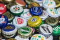 Background of beer bottle caps, a mix of various global brands Royalty Free Stock Photo