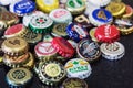 Background of beer bottle caps, a mix of various global brands Royalty Free Stock Photo