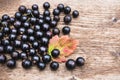 Berries is black currant on a wooden table. Royalty Free Stock Photo