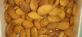 Background of big raw peeled almonds situated arbitrarily Royalty Free Stock Photo