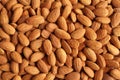 Background of big raw peeled almonds situated arbitrarily Royalty Free Stock Photo