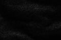 Background of black coarse fabric texture in the dark Royalty Free Stock Photo