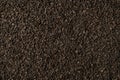Background of black fanning or broken loose leaf tea. Close up, top view. Royalty Free Stock Photo