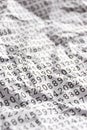 Printed random numbers on crumpled white paper