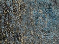 Background with blue and black paint flaking off a wall Royalty Free Stock Photo