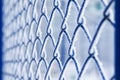 Background of blue grid metal lath covered with fluffy white cry