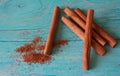 Cinnamon sticks on a blue background shabby chic. Royalty Free Stock Photo