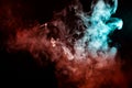 A background of blue, red and green wavy smoke in the shape of a Royalty Free Stock Photo